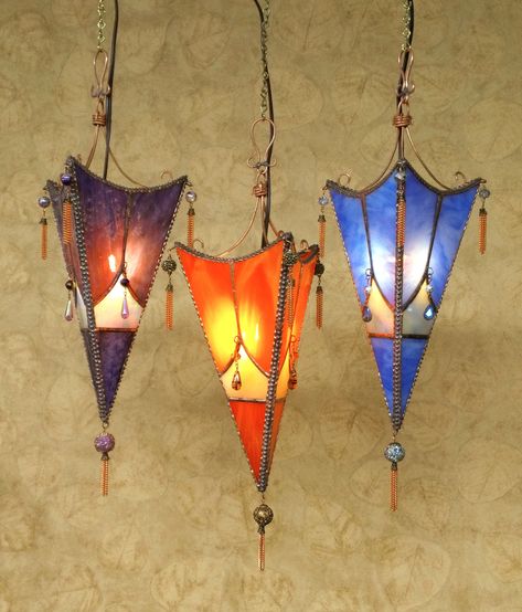 "Bohemian Style Hanging Sconces Intimate lighting - Tapered triangular stained glass sconce, decorative soldered edges with antique copper finish, hand made bead and chain tassels, copper wire hanger also formed by hand. Photos are taken in semi low light to show the colors as accurate as possible. MADE TO ORDER - Sconce tapers to 10\" long (14\" from top of hanger to bottom) x 7\" at widest point. Comes with a 6 ft. clip-in cord with on/off switch, and an optional wrought iron wall hanger (6\" Hand Photos, Hanging Sconces, Copper Bedroom, Intimate Lighting, Stained Glass Hanging, Stained Glass Light, Inspired Interiors, Stained Glass Lamps, Stained Glass Crafts