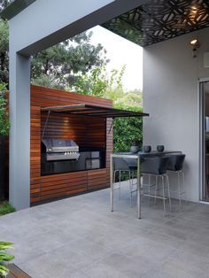 hidden outdoor kitchen #bbq #modern #Patio Parrilla Interior, Modular Outdoor Kitchens, Outdoor Cooking Area, Brighton Houses, Outdoor Kitchen Appliances, Contemporary Patio, Kitchen Designs Layout, Diy Outdoor Kitchen, Bbq Area