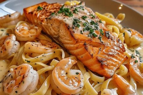 Indulge in this creamy Salmon and Shrimp Alfredo recipe. Rich seafood, tender pasta, and a luscious Alfredo sauce. Perfect for any dinner! Salmon And Shrimp Alfredo Pasta, Salmon Alfredo Pasta Recipes, Alfredo With Salmon, Seafood Alfredo Pasta, Salmon And Shrimp Recipes, Salmon And Shrimp Alfredo, Pasta Salmon, Seafood Alfredo, Shrimp Stuffed Mushrooms