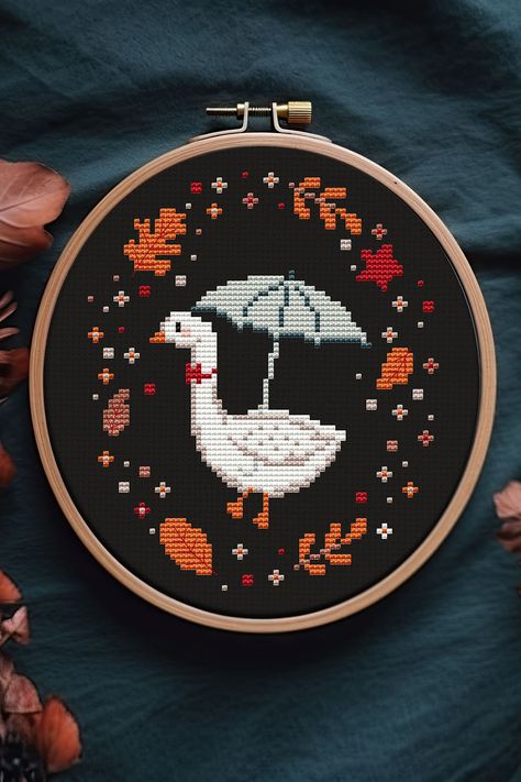 Get into the cozy autumn spirit with adorable Autumn Farmhouse Cross Stitch Pattern. This delightful PDF pattern features a charming goose, a small farm, and all the fall vibes you need to bring warmth and joy to your home. Whether you're a seasoned stitcher or just starting out, this easy-to-follow pattern is perfect for creating a cute and festive addition to your kitchen decor. Stitch away and get ready to celebrate Thanksgiving in style! Cozy Cross Stitch Pattern, Cross Stitch Patterns Fall, Cross Stitch Fall Patterns, Goose Embroidery Pattern, Cozy Cross Stitch, New Home Cross Stitch, Cross Stiches Ideas Easy, Simple Cross Stitch Patterns Free, Fall Cross Stitch Patterns Free