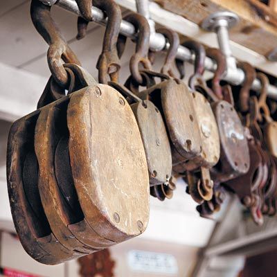 From Trash to Furniture Treasures - This Old House Pulley Lamps, Pulley Light, Salvaged Doors, Wood Shelving Units, Block And Tackle, Tin Ceiling Tiles, Barn Board, Island House, Antique Interior