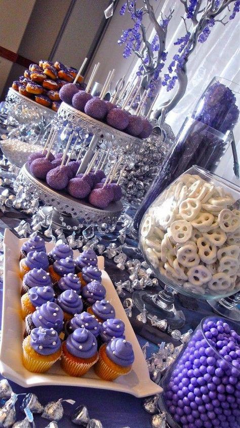 Purple Themed Dessert Table.  You can put anything at your dessert table: Cake pops, donuts, cupcakes, mini cakes, cookies, or candies. #BoozyDessertsforAdults Purple Cake Pops Recipe, Purple And Silver Dessert Table, Birthday Party Food Purple, Purple Wedding Dessert Table, Purple Finger Food, Purple Party Foods, Purple Candy Table, Purple Dessert Tables, Purple Candy Buffet