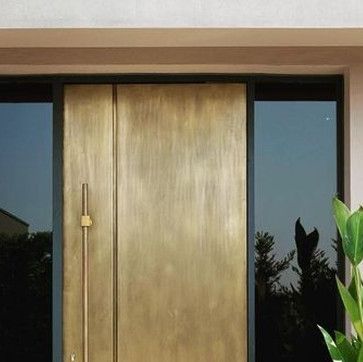 Aluminr on Instagram: "Gorgeous handmade contemporary front door design for a plush home in Austria. The satin-antique finish of the brass door accentuates its solid structure and creates an element of intrigue. The tall pull brass rod handle gives a pleasurable hand feel.

#brassdoors #lifestlybyaluminr #bronzedoors #luxury
#contemporaryart #modernarchitecture #frontdoors #entrancedoors #contemporarydoor #doorideas #instadoors #doorgoals #maindoor #luxurymetaldoors #luxurvdoors
#entrancedecor #aluminrworld #bronzedoor #brassdoor
#pivotdoor #pivotdoors" Brass Front Door, Contemporary Front Doors, Brass Rod, Contemporary Door, Pivot Doors, Front Door Design, Main Door, Entrance Decor, Brass Door