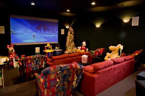 Even the home theater (with a Disney theme naturally) has a little Christmas tree. Disney Movie Room, Disney House Ideas, Casa Disney, Disney Room Decor, Little Christmas Tree, Log Home Living, Disney Furniture, Best Home Theater, Home Theater Setup