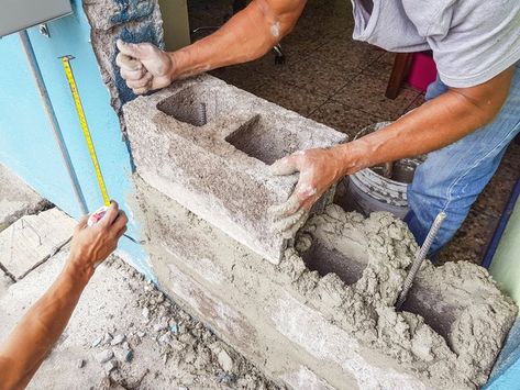 Cinder block is a useful material that can create solid structures indoors and out. While the popular material may be high in durability, it is rather low in aesthetic. Installing tile on a cinder block wall can greatly increase a room's appeal. To tile a block wall, follow a few easy steps. Landscape Fence Ideas, French Cabin, Diy Concrete Slab, Cinder Block Projects, Pouring Concrete Slab, Concrete Calculator, Hypertufa Projects, Concrete And Brick, Pouring Concrete