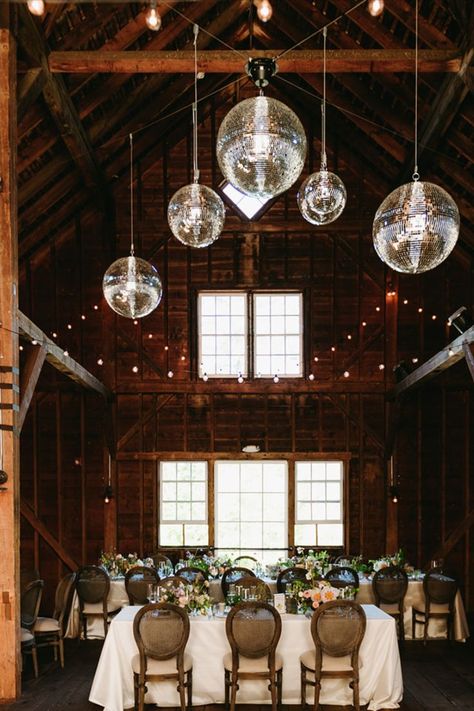 Wedding Reception Decor with elegant hanging decor ideas! | 2024 wedding, boston wedding, boston wedding planner, wedding planning ideas, wedding floral arrangement, wedding floral inspo, wedding flowers, wedding flower colors, wedding floral trend, Wedding Reception Disco Ball, Disco Ball Wedding Reception, Disco Balls Wedding, Hanging Disco Balls, Wedding Flower Colors, Hanging Decor Ideas, Disco Ball Wedding, Barn Wedding Reception, Rustic Wedding Reception