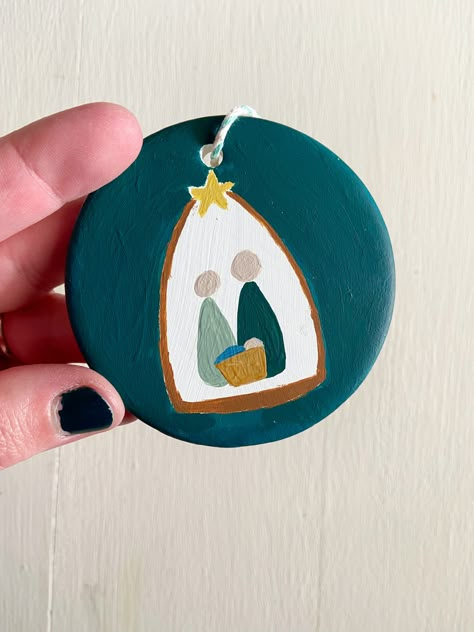 Nativity Ornaments are a sweet addition to decorate your home or tree this holiday season. These hand-painted, one of a kind ornaments make great gifts too. The Nativity Ornaments can be hung throughout the winter season as a reminder of the reason of the season. Give an ornament as a gift or buy multiple to start a collection. acrylic on 3" round clay disc Homemade Nativity Ornaments, Painted Acrylic Ornaments Diy, Wood Slice Nativity Ornament, Wood Round Ornaments Diy Kids, Ornament Ideas Painting, Diy Ornaments Paint, Nativity Painted Rocks, Christmas Ornaments Painting Ideas, Diy Acrylic Christmas Ornaments