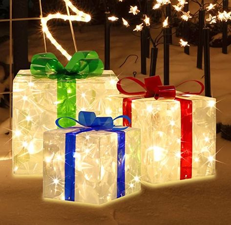 Three boxes are connected together by the wire and distance between each is 27.5'' and the leading wire is 118‘’ in length.
🎁PREMIUM QUALITY: lighted Christmas gift boxes is designed with a sturdy metal frame covered with premium transparent PVC with IP44 waterproof power adapter. It is great ideal to light up your Christmas season. ETL certicated and 6pcs metal Stakes included. Box Christmas Decorations, Up Decorations, Christmas Gift Boxes, Cartoon Giraffe, Giraffe Pattern, Floral Print Pants, Sunflower Print, Christmas Gift Box, Summer Gift