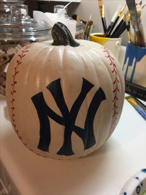 The road to October...NY Yankees pumpkin Yankees Pumpkin Painting, La Dodgers Pumpkin Carving, Pumpkin Decorating Baseball, Baseball Pumpkin Painting, Baseball Pumpkins Ideas, Baseball Pumpkin Carving Ideas, Pumpkin Baseball Ideas, Baseball Painted Pumpkins, Baseball Pumpkin