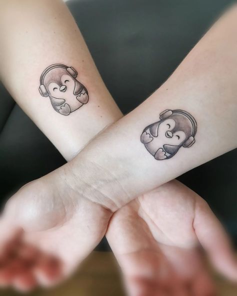 x If you’re looking for some inspiration, check out these awesome penguin tattoos: 1. Little Penguin Tattoo https://www.instagram.com/p/ChxtBxbJBQK/ A penguin wearing a batik T-shirt sound weird but you know, there is no limit for imagination. Go for this fun and creative tattoo. 2. Cool Penguin Tattoo  https://www.instagram.com/p/CcRtedmD45A/ The penguin above looks like a rock star, doesn’t he? If you are fond of rock music and style, you can turn your penguin into a rock star. 3. Pen Music Friend Tattoos, Best Friend Penguin Tattoo, Penguin Tattoo Small Couple, Matching Music Tattoos Couples, Cartoon Penguin Tattoo, Music Best Friend Tattoos, Matching Music Tattoos Friends, Couple Tattoos Music, Matching Penguin Tattoos Couples