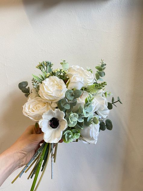 Black Eyed Anemone Greenery Boho Bouquet / Woodland Bouquet / Artificial Flower Bouquet / Fake Flower Bouquet Handmade by Hiddenbotanics LARGE BRIDAL BOUQUET SHOWN IN THE PHOTOS Bridesmaids Medium: 33 x 20 Bridal Large : 40 x 30 ------- This beautiful bouquet and crown are perfect for your boho weddings! Stay floral! ------- Follow us on Facebook and Instagram for exclusive deals and discount coupons: Facebook: https://www.facebook.com/hiddenbotanics/?eid=ARCW028kmVfrYLow7IKnusN1HPY_LKxr10vWQKPg Aneome Bridal Bouquet, White Flower With Black Center, Olive Green Bridesmaid Dress Bouquet, Flower Bouquet For Black Dress, Prom Bouquet For Black Dress, Bouquet For Black Dress, Prom Bouquet Black Dress, Bouquet With Black Dress, Prom Flowers Bouquet Black Dress