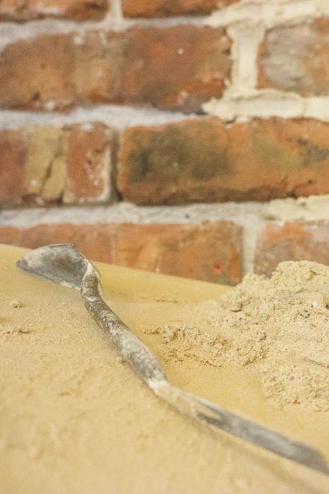 Lime mortar and a pointing trowel with a freshly pointed brick wall. Lime Mortar, Stone Masonry, Brickwork, Stone