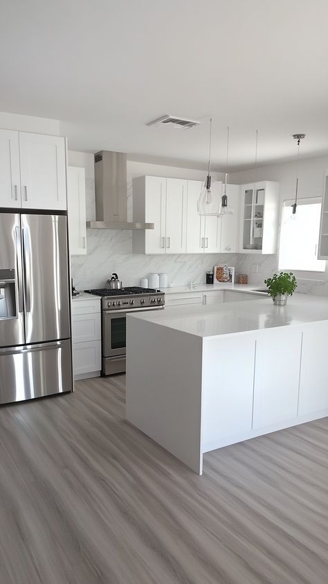 Embrace the Virgo aesthetic in this minimalist kitchen 🏡✨. With sleek white cabinets, glistening stainless steel appliances, and an herb garden 🌿, every detail is perfection. Organized pantry space, clean lines, a functional island, and abundant natural light create a harmonious vibe. 🌟🍽️ White Apartment Aesthetic Kitchen, Clean Aesthetic Kitchen, Clean Girl Kitchen, White And Silver Kitchen, Clean Kitchen Aesthetic, White Minimalist Kitchen, House Interior Design Kitchen, Clean White Kitchen, Small White Kitchen