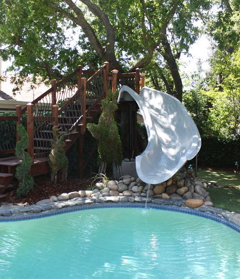 This homeowner stepped out of the box when she added a beautiful 15.5' Dolphin slide to her pool. The gorgeous stairway landing adds a simple elegance to the wa… Pool Slide Diy, Inground Pool Slides, Above Ground Pool Slide, Water Slides Backyard, Swimming Pool Slides, Pool Water Slide, Stock Pools, Yard Makeover, Potato Rolls