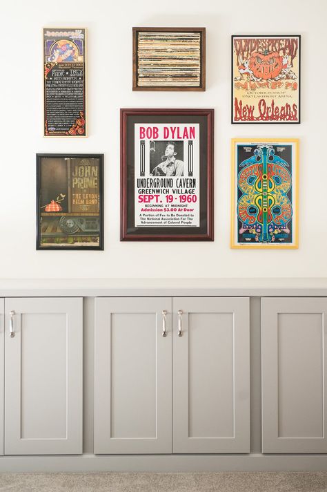 A concert poster collection in the basement is elevated thanks to framing them. Concert Poster Frame Ideas, Concert Posters Framed, Framed Concert Posters On Wall, Poster Design On Wall, Concert Posters Aesthetic, Concert Poster Wall Display, Music Poster Gallery Wall, Band Poster Wall Room Ideas, Music Prints Wall Art