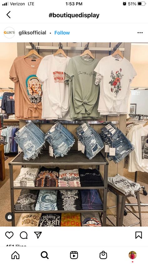 Small Business Tshirt Display, Small Business Shirt Display, Tshirt Table Display Ideas, Booth Merchandising Ideas, Shorts Display Ideas, Tshirt Displays Retail, Clothing Booth Display Ideas Tent, Small Town Boutique Ideas, Jean Display Ideas