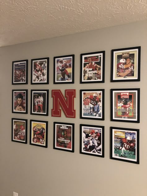 Sports gallery wall. Man cave Sports Photo Wall Display, Sports Room Decor Man Caves, Sports Picture Wall Ideas, Sport Gallery Wall, Man Cave Ideas Room Small Sports, Basement Sports Decor, Man Cave Sports Room, Sports Memorabilia Display Wall, Sports Basement Ideas