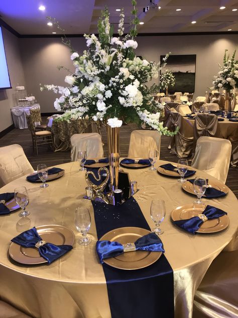 Navy Blue White Gold Wedding, Navy Gold And White Wedding Decor, Navy Blue White And Gold Wedding Centerpieces, Dark Blue And Gold Centerpiece, Center Pice Ideas, Navy Gold Decorations, Blue And Gold Backdrop Party Ideas, Black Gold And Royal Blue Decor, Blue White And Gold Wedding Decorations