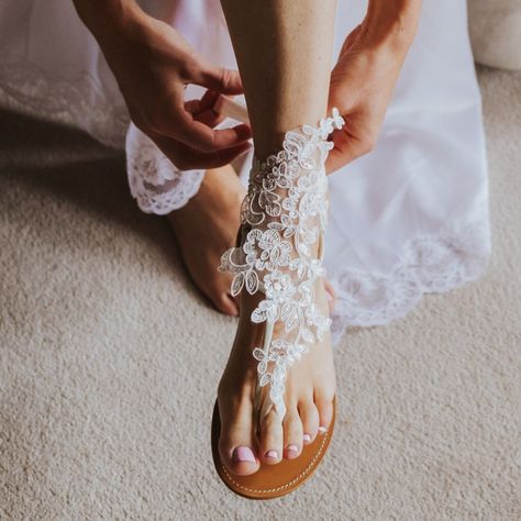 39.99 USD French lace bridal barefoot sandals offer a touch of sophistication, married with bohemian sensibilities, to give you a remarkably comfortable alternative to traditional shoes while walking thru the sand to marry the man of your dream. Featuring a French lace, shiny sequins and a really comfortable elastic ribbon, these boho wedding sandals are a popular choice for beach weddings barefoot brides. Available in a choice of two colors will complement your big day outfit splendidly. One… Boho Barefoot Sandals, Comfy Wedding Shoes, Bridal Foot Jewelry, Lace Barefoot Sandals, Bride Sandals, Boho Wedding Shoes, Barefoot Sandals Wedding, Beach Wedding Sandals, Wedding Anklets