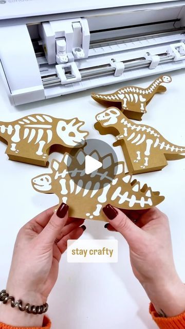 Dinosaur Mama | Craft Tutorials | Free SVG Files on Instagram: "How cute are these little Dino bone treat boxes. You can even use them for Dino party decor 🦖🦕  I used my @silhouette.inc Cameo 5 (and Portrait 3) to cut these guys out and found the designs on the Silhouette Design store.   Tip: if your paper crafts have a lot of pieces to place - save the middle as a guide. This also works great for lettering!   #craftthings #silhouettecameo #silhouettestudio #silhouettecameo5 #papercraft" Dinosaur Party Decorations Diy, Dinosaur Party Diy, Cricut Dinosaur Projects, Paleontology Party, Dino Party Decor, Dino Party Decorations, Dinosaur Classroom, Dino Bones, Dinosaur Craft