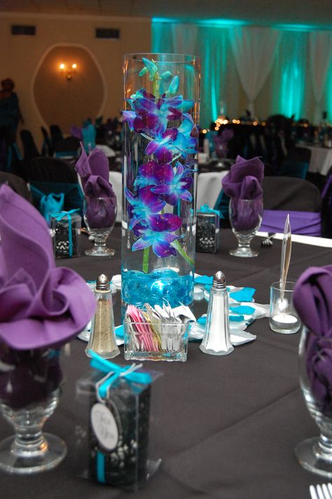 Teal And Purple Wedding Centerpieces, Black And Blue Centerpiece Ideas, Purple And Blue Event Decor, Purple Teal And Red Wedding, Purple Teal And White Wedding, Royal Purple And Turquoise Wedding, Black Purple And Turquoise Wedding, Blue Gold And Purple Wedding, Purple And Blue Wedding Reception