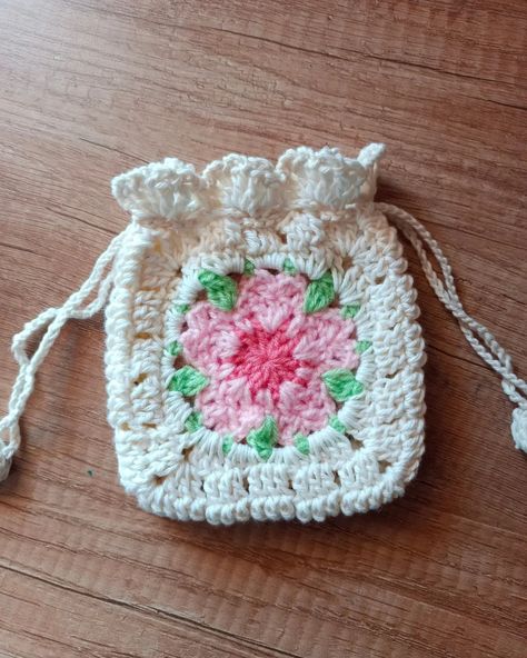 Sakura Granny Square Pouch . . . #crochetersofinstagram #sakura #crochetsakura #crochetsakuraflower #crochetkawaii #drawstringbag #crochetairpodscase #airpodpouch #crochetpouch #crochetapplique #grannysquare #grannysquaresrock #stopmotionanimation #sakuragrannysquare #india #indiasmallbusiness #indiacraftingmemories #indiahandicrafts #handmadeindia #handmadewithlove #handmadegifts #pinterestinspired #rainbowdustcrochetry #smallbuisnesscommunity #smallbusinessindia #indiacrochetclub #punesm... Sakura Granny Square, Granny Square Pouch, Pouch Crochet, Crochet Pouch, Christmas Calendar, Sakura Flower, Crochet Applique, Granny Squares, Stop Motion