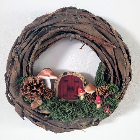 Fairy Door Wreath Gnome Home Woodland Decor Cottage Core Pine Cone Mushroom Autumn Neutral Cute Home Gifts for Fall This adorable wreath would look great for your front door for autumn. It measures 30cm 12 inches in diameter. It is accented with an adorable door, pinecones, and mushrooms.  I hang mine simply with a nail on the wall. I can add some twine if you would want for hanging. I also can create a custom wreath just contact me. Mushroom Autumn, Christmas Hanging Baskets, Fairy Wreath, Couronne Diy, Enchanted Woodland, Gnome Home, Random Products, Moon Crafts, Boho Crafts Diy