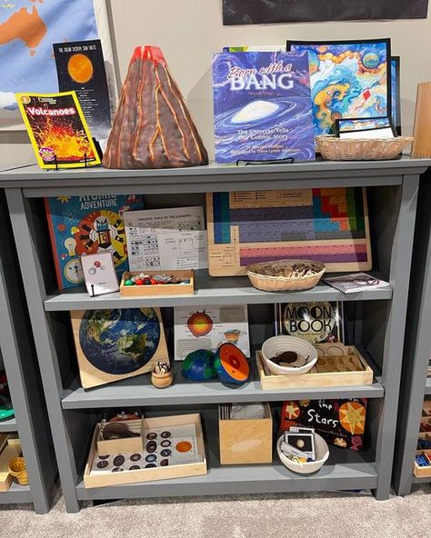 Jenna on Instagram: "🌋 🪐 First Great Lesson Activities 🧬 🌟 We have been continuing our study of the formation of the universe by using some of these wonderful resources. I plan to fill this shelf with materials that correspond to each great lesson. We will finish up the study of the 5 Great Lessons by the end of January, and then we will focus on geography by doing detailed continent studies. On this shelf: 🌋 Volcano model (@learningresources ) 🌟 Cosmic Story Mat (@wasecabiomes ) 🧪 Molecu Volcano Unit Study, Preschool End Of Year, Montessori Elementary Classroom, Volcano Model, Homeschool Room Design, Reggio Emilia Classroom, Montessori Geography, Lesson Activities, Montessori Elementary