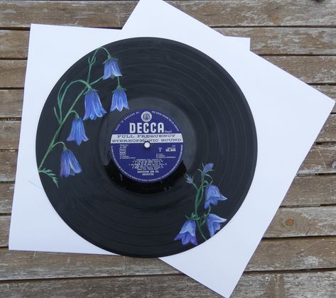 Hand painted artwork of Harebell flowers on an upcycled 12" vinyl record! Original artwork only one copy available Perfect for presents, room decor, or just for brightening up a space :) Painting Ideas Record, Painted Record Ideas, Painted Records Vinyl Easy, Record Painting Ideas Aesthetic, Painting On Records Vinyls, Vinyl Painting Ideas, Painted Vinyl Records Wall Art, Harebell Flower, Painted Records Vinyl