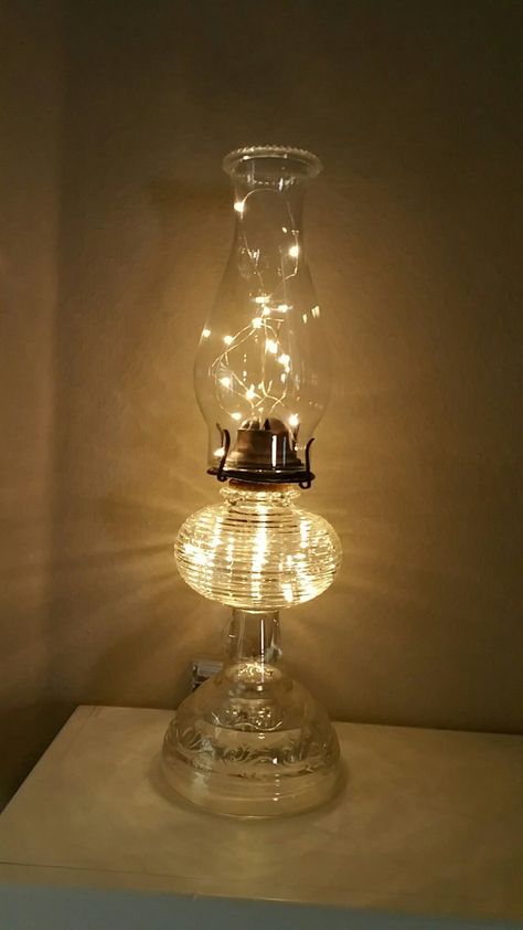 Oil Lamp With Fairy Lights, Oil Lamps Decorations, Repurposed Oil Lamps, Oil Lamp Repurposed, Antique Lanterns Decor Ideas, Oil Lamp Christmas Decor, Oil Lantern Decor Ideas, Vintage Oil Lamp Decor Ideas, Old Lamps Repurposed