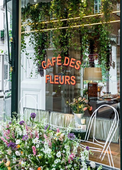 Welcome to Café des Fleurs, a Parisian garden inspired by the iconic film Amelie. Floral Cafe Coffee Shop, Floral Coffee Shop, Coffee Flower Shop, Coffee And Flower Shop, Flower Coffee Shop, Flower Shop Cafe, Paris Flower Shop, Flower Shop Branding, Florist Cafe