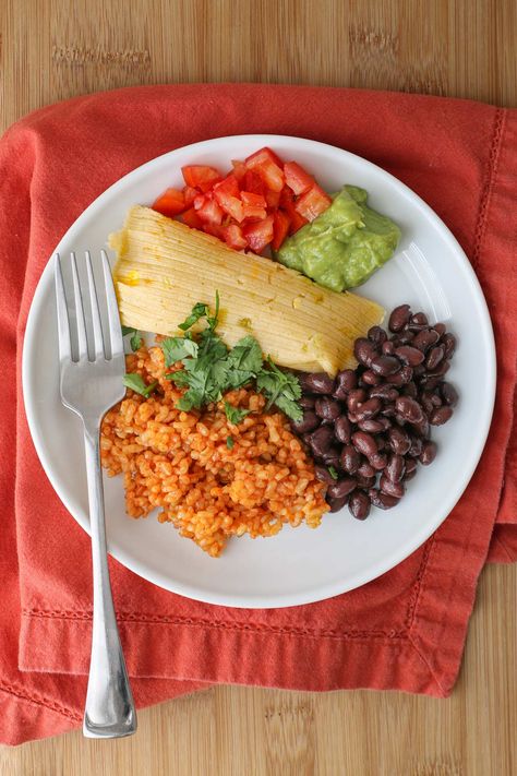 Tamales are a delicious Mexican food dish that is worth the effort to make at home. This simplified Cheese Tamales recipe is a perfect starting point. The vegetarian tamales come together quickly and easily, packed with flavor but without the hassle of a traditional filling. Serve these Cheese Tamales alongside Mexican Rice, Black Beans, and your favorite salsa or guac. Be sure to save some extra to freeze! Cheese Tamales Recipe, Tamales Ingredients, Cheese Tamales, Vegetarian Tamales, Tamale Filling, How To Make Tamales, Meal Train, Tamales Recipe, Rice Black Beans