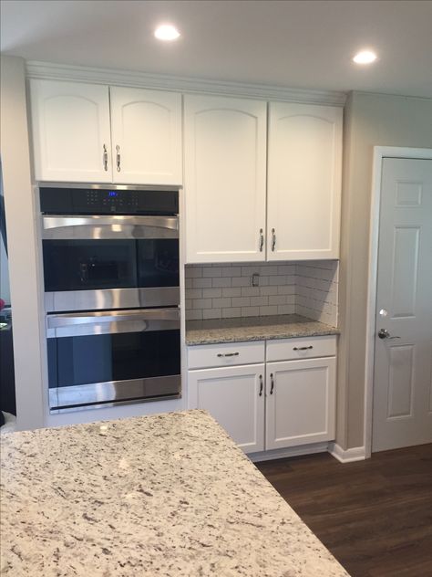 The oven line, with the "Ornamental White" granite, white subway tile, and biscuit grout selections! Ornamental White Granite Countertops, Ornamental White Granite, Granite With White Cabinets, Marble Inspiration, Grout Colors, Lake Condo, Small American Kitchens, Greige Kitchen, Artistic Kitchen