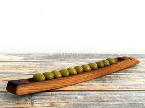 Elegant, rustic home decor from Napa Valley for your table. This unique, handmade wooden serving tray is made for olives and small bites. Sometimes theyre called olive boats or olive trays, due to the long narrow shape, but we think they are an idea serving dish for all sorts of Boat Charcuterie, Host Gift Ideas, Olive Tray, Christmas Hostess Gifts, Barrel Projects, Olive Dishes, Wooden Serving Boards, Barrel Furniture, Handmade Holiday Gifts