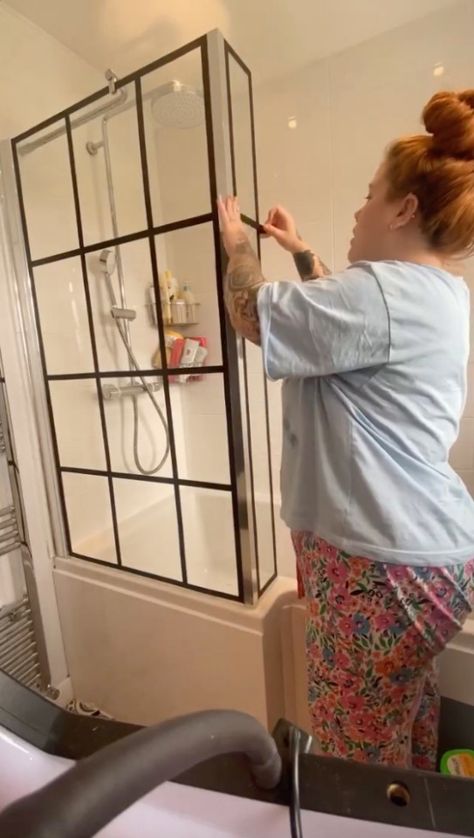 SOMETIMES all it takes is a small tweak to make a huge difference when it comes to upgrading your home – as one woman has found out. The DIY fan transformed the look of her bathroom by updating her tired-looking shower screen for under a tenner. Amy Stanyer-Jones wanted to install a black-framed screen instead […] Shower Door Ideas Diy, Diy Black Shower Door, Black Shower Bathroom Ideas, Bath Screen Ideas, Black Bathroom Doors, Shower Door Makeover, Bathroom Shower Screen, Shower Screen Ideas, Diy Shower Panels