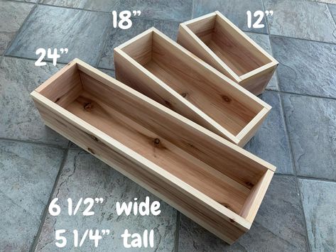 About this product: Real Cedar Wood Planter Boxes. Natural cedar wood. Can be stained, pained and stressed. Great for Weddings, Christmas, Thanksgiving, Holidays, Special Occasions, Flowers Boxes, Gifts and Table Decorations. Description: 1) Made from 0.625" thick Cedar Wood, and finish nails.  2) Available in three sizes, 12", 18", and 24" long.  3) All Boxes are 6 1/2" wide and 5 1/4" tall IMPORTANT: If you are having difficulty understanding how to place and order, or if you have questions ab Wooden Centerpiece Boxes, Wood Christmas Baskets, Wood Box Ideas Decor, Wooden Table Centerpiece, Picket Projects, Wood Planter Boxes, Wedding Rustic Decor, Diy Wood Planter Box, Cedar Wood Projects