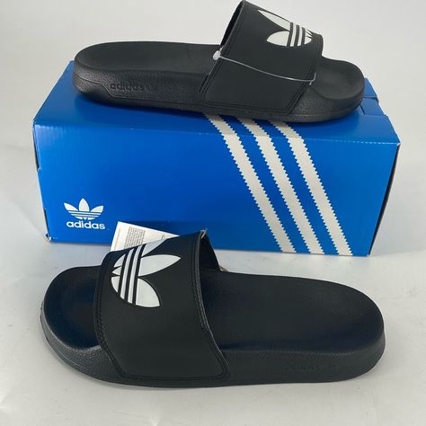 New In Box With Tag Size: Men's 6 Women's 7 Full-Time Vacation Vibes. These Adilette Lite Slides Free Your Feet. (Or Wear Them With Socks, No Judgment Here.) This Pair Features A Super-Soft Footbed For An Instantly Comfy Feel. There's An Adidas Trefoil On Top So You Can Feel Sporty, Even When You're Lounging. Slip-On Synthetic Bandage Upper Super-Soft Feel Cushioned Sporty Slides Synthetic Outsole Product Color: Core Black / Cloud White / Core Black Product Code: Fu8298 These Will Be Shipped Wit Color Core, Mens Shoes Sandals, Black Clouds, Vacation Vibes, White Core, Adidas Trefoil, Cloud White, Black Slip Ons, Black Adidas