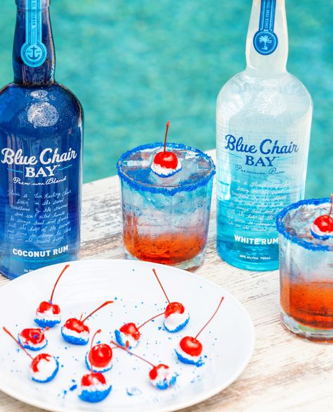 We are ready to celebrate America with a 4th of July cocktail and treat!⁠ This duo is the perfect way to add red, white, and blue to your 4th.   These layered drinks and cherry bombs are easy and delicious!  #bluechairbay #coconutrum #whiterum #cherrbombs Red White Blue Drink, Blue Alcoholic Drinks, Coconut Rum Drinks, Bartender Recipes, Patriotic Drinks, Key Lime Rum Cream, Fourth Of July Drinks, 4th Of July Cocktails, Layered Drinks