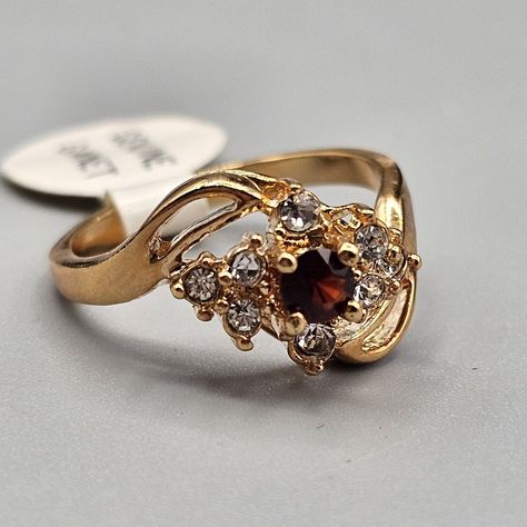 Size 7 Nwt Ring With Garnet Center Stone And Crystal Accent. Bypass Gold Tone Band. Signed Taiwan Wedding Garnet Gemstone Filigree Ring, Wedding Garnet Filigree Ring With Gemstone, Formal Garnet Filigree Ring With Gemstone, Elegant Garnet Filigree Ring With Gemstone, Luxury Antique Garnet Rings, Helaena Targaryen, Antique Style Rings, Ring Crystal, Ring Inspo