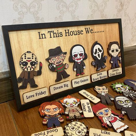 Our "In This House We..." series of custom wooden signs offer a wide variety of fun styles to choose from. Each product features an iconic horror movie character or cartoon horror costume image, perfect for fans of classic horror movies or Halloween horror themed home decoration. It is a unique and fun way to show your love for iconic characters while highlighting the values and activities that your family cherishes. Its detailed design and personalized elements make it a striking piece that reflects your passion and uniqueness. It will be a great gift for family or friends on Halloween, adding a touch of horror and fun to your home! Christmas Family Signs, Horror Movie Signs, Family Signs Wooden, House Horror Movie, Horror Movie Design, Movie Design, Halloween Wood Signs, Horror Costume, Frame Sign