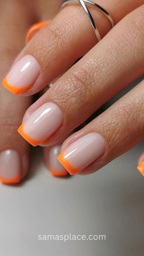 Elegant hand showing off a minimalist nail design with a sheer nude base and bright orange borders on a set of oval nails. Acrylic Nails Neon Orange, Neon Orange French Tips, Acrylic Nails Neon, Orange French Tips, June Nails Ideas, Acrylic Nail Designs Classy, June Nails, Nail Courses, Pink Polish