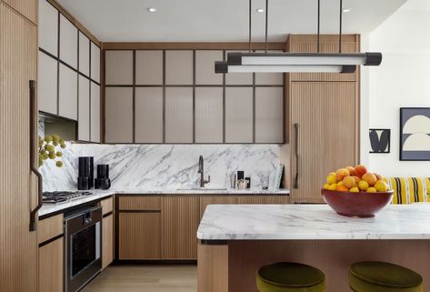 Tour Lantern House, Thomas Heatherwick’s First U.S. Residential Project | Architectural Digest Fluted Door, Glass Upper Cabinets, Lantern House, Thomas Heatherwick, Natural Wood Kitchen, Lacquered Walls, Grey Kitchen Island, Upper Kitchen Cabinets, Door Detail