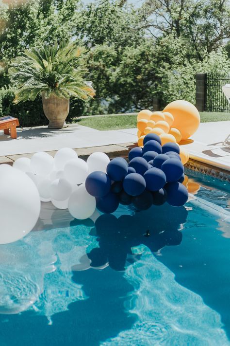 Pool balloons, balloon garland, navy blue balloons, pool balloon garland, pool party ideas, pool party, pool party decor, party decor, navy and yellow party decor Graduation Pool Party Ideas, Pool Balloons, Dubai Ideas, Succulent Cakes, Backyard Pool Party, Mexican Pan Dulce, Pool Party Adults, Backyard Pool Parties, Decor Balloons