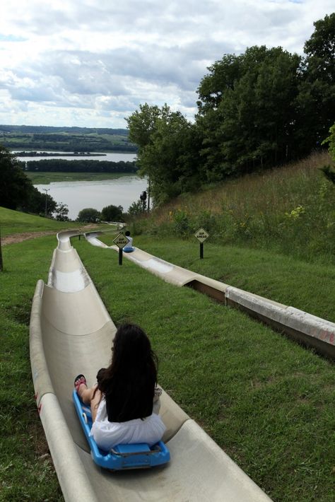 Alpine Slide - Chestnut Mountain Resort - Race down 2,050 feet of tailored track on a sled to the banks of the Mississippi on the ride of your life. Our scenic lift whisks you back to the top of the mountain where a gorgeous panoramic view of three states is unveiled. The view is just as much of an attraction as the downhill adrenaline rush itself. Alpine Slide, Cabin Trip, Top Of The Mountain, Adrenaline Rush, Us Road Trip, Wildlife Safari, Whisks, Panoramic View, Mountain Resort