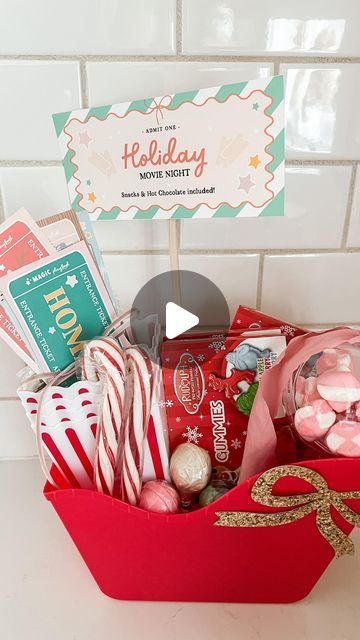 Caitlin Kruse on Instagram: "Dollar Store Holiday Movie Night basket!! I can think of so many people this would be great for: neighbors, teachers with young kids, family friends or even a hostess gift. Your elves could bring it for your kids or you could surprise them with it! Everything was still in stock at my @dollartree this week! The printable holiday movie tickets are in the @themagicplaybook membership site." Christmas Movie Night Basket Ideas, Christmas Movie Basket, Christmas Movie Gift Basket, Movie Night Basket Ideas, Family Movie Night Gift Basket, Family Movie Night Gift, Movie Basket, Movie Basket Gift, Movie Night Basket