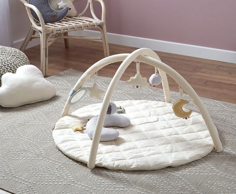 The luxurious organic cotton lining of this soft floor gym plays an important role in protecting your babies in the process of learning to stand and play. Parents can also enjoy a comfortable and safe playtime with their children with this activity gym Baby Gym Mat, Tummy Time Pillow, Wooden Play Gym, Baby Activity Gym, Wooden Baby Gym, Baby Mirror, Tummy Time Mat, Baby Play Gym, Baby Sensory Toys