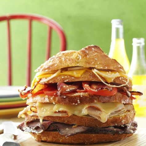 Big Sandwich Recipe -One look at this impressive sandwich and your family and friends will know their taste buds are in for a treat. I have served it many times for casual lunches and suppers. The tall layers prompt people to ask how they're supposed to eat it. I encourage them to simply dig in and enjoy! —Margaret Yost, Tipp City, Ohio Sandwich Recipes Turkey, Paninis Recipes, Turkey Sandwich Recipes, Dagwood Sandwich, Ham Sandwich Recipes, Stuffed Breads, Turkey Sandwiches Recipes, Big Sandwich, Beef Sandwiches