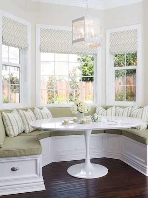 don't super love all the green, not as warm -but there is something appealing about this nook- the varying fabric and symmetry is appealing Breakfast Nook Bay Window, Bay Window Seating Kitchen, Seating In Kitchen, Breakfast Nook Bench, Kitchen Bay Window, Nook Bench, Window Seat Kitchen, Banquette Seating In Kitchen, Bay Window Seat