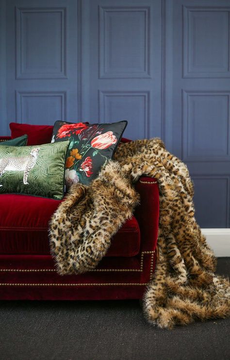 Latest interior trends for your home this autumn - leopard print throws, velvet cushions and red velvet sofa. Explore our latest blog post on how to create a cosy bedroom or living this season with faux fur throws, luxury textures and dark walls. Red Velvet Couch, Red Sofa Living, Red Sofa Living Room, Red Velvet Sofa, Luxury Bedspreads, Bedroom Dark, Animal Print Decor, Red Couch, Cosy Bedroom