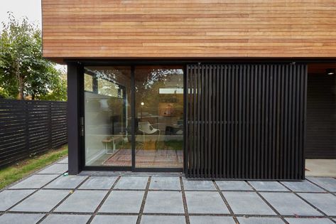 Photo 18 of 25 in The Mansfield Frogner House by Joe Mansfield - Dwell Vertical Wood Siding, House Addition, Accessory Dwelling Unit, Modern Accessories, Wood Siding, Shipping Containers, St Andrews, Home Additions, Modern Exterior